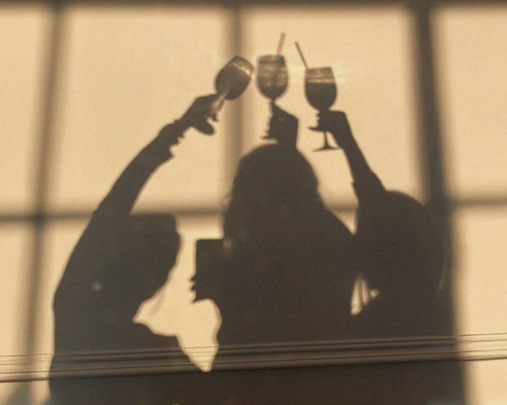 Midlife woman considering the impact of social drinks on menopause and hormones